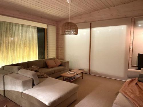 Alloca Beach Shack lounge room at night